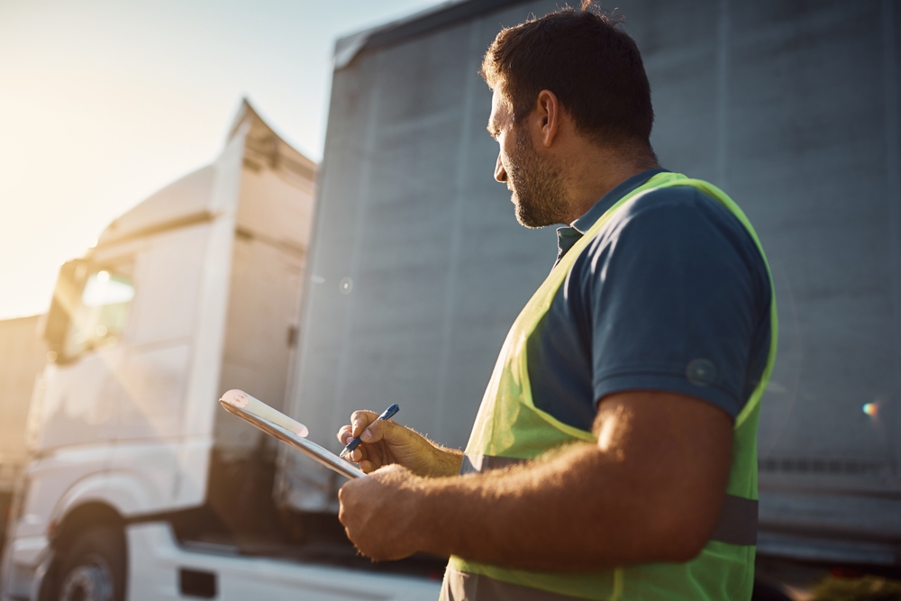 Trucking Company Dispatcher Going Through Checklist